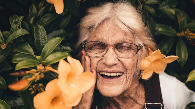 Elderly woman with bright smile symbolizing super aging and cognitive health