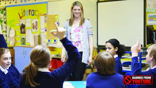 Becoming Passionate About Public Education Again teacher standing in front of students in an open classroom