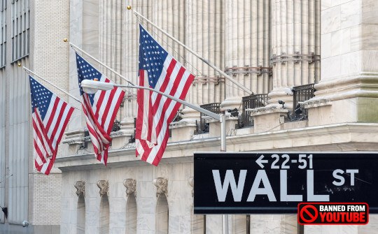 Making Dollars Count: Shifting Economic Focus from Quantity to Quality photo of wall street with American flags